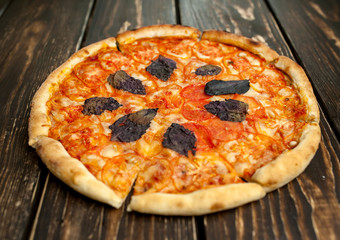 pizza on a wooden table