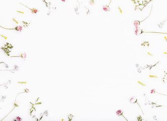 Obraz na płótnie Canvas Festive flower composition on the white wooden background. Overhead view