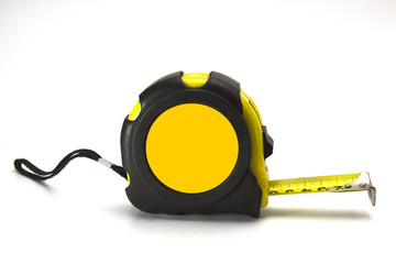 Yellow and black construction tape on a white background close up