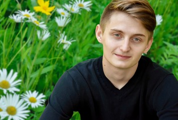 young man among the daisies