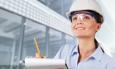 Portrait of young student of architecture  on background