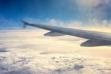 View above the clouds from the airplane window