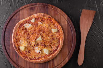Pizza, food, vegetable, margarita.  Vegetables, mushrooms and tomatoes pizza on a black wooden background. It can be used as a background