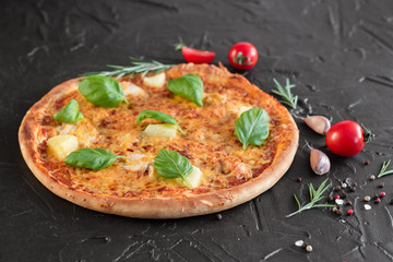 Pizza, food, vegetable, margarita.  Vegetables, mushrooms and tomatoes pizza on a black wooden background. It can be used as a background