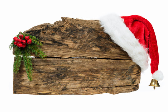 Christmas template - old wooden sign with Santa hat and spruce twig on white background - Powered by Adobe