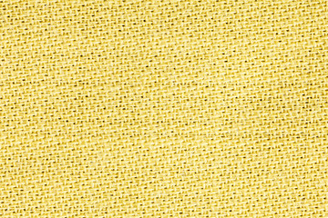 Yellow linen fabric of cloth texture background. Detail of textile material close-up.