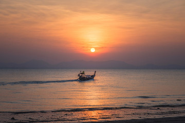 Seascape at sunset with boat