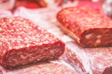 Sausages on in showcase in a meat shop.