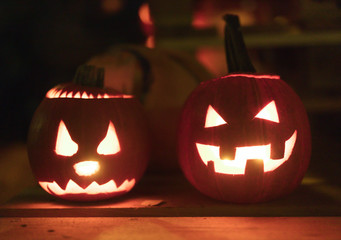 Illuminated figures made of pumpkins. Helloween night.