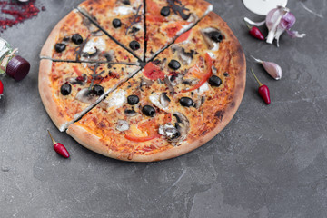 Pizza, food, vegetable, mushrooms.  Vegetables, mushrooms and tomatoes pizza on a black wooden background. It can be used as a background