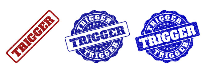 TRIGGER grunge stamp seals in red and blue colors. Vector TRIGGER watermarks with draft surface. Graphic elements are rounded rectangles, rosettes, circles and text labels.