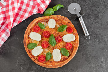 Pizza, food, vegetable, margarita.  Vegetables, mushrooms and tomatoes pizza on a black wooden background. It can be used as a background
