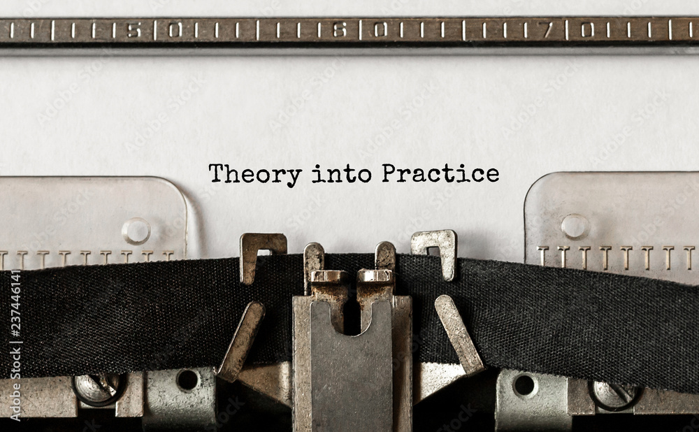 Fototapete text theory into practice typed on retro typewriter