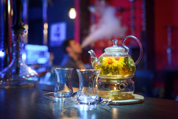 flower tea and two cups on the table