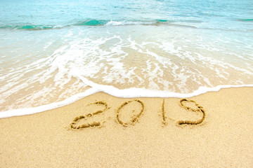 New Year 2019 on the sandy shore against the backdrop of sea waves.