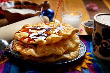 Mexican buñuelos with piloncillo syrup