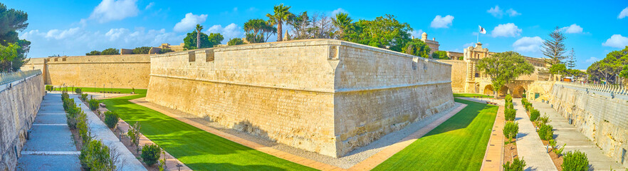 Thepanorama of St Peter's Bastion of Mdina citadel, surrounded by ornamental garden, stretching...