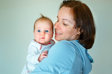 Happiness maternity concept. Mom and baby at home