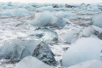 view of the ice floes in sea, by the beach in Jökulsárlón, Iceland