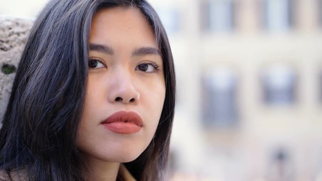 Asian Beautiful young woman looking in the city-close up- slow motion