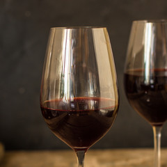 wine, red wine, transparent glass on a wooden table, a gift. Top view. copy space