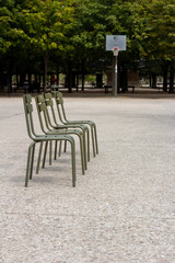 Fototapeta na wymiar Line of chairs in front of basketball goal