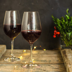 wine, red wine, transparent glass on a wooden table, a gift. Top view. copy space