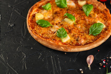 pizza, pineapple, chicken, tomato sauce, cheese, basil (pizza ingredients). Hawaiian pizza. Top view. copy space