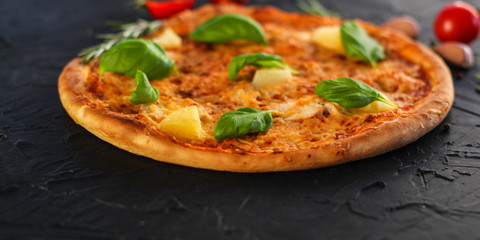 pizza, pineapple, chicken, tomato sauce, cheese, basil (pizza ingredients). Hawaiian pizza. Top view. copy space