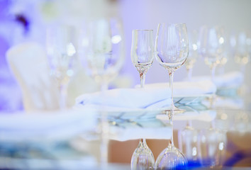 Empty glasses set in restaurant. Part of interior