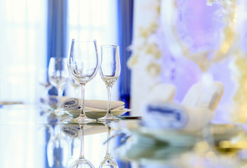 Empty glasses set in restaurant. Part of interior