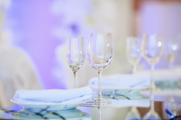 Empty glasses set in restaurant. Part of interior