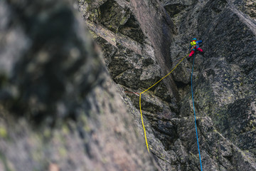 Alpine climbing adventure. A climber or an alpinist ascending big wall in High Tatras, Slovakia....
