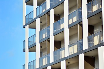 Modern apartment buildings on a sunny day with a blue sky. Facade of a modern apartment building