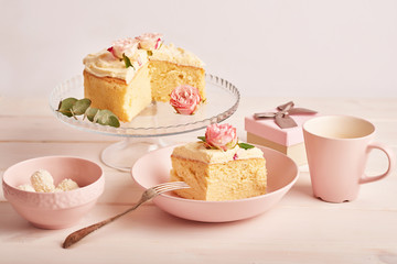 naked cake with roses on white background