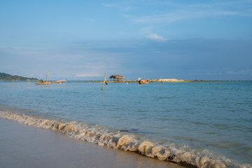 Traditional Asian long tail fishing boats moored at Bang Kao beach, Koh Samuui, Thailand.