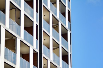 Modern apartment buildings on a sunny day with a blue sky. Facade of a modern apartment building