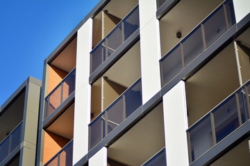 Modern apartment buildings on a sunny day with a blue sky. Facade of a modern apartment building