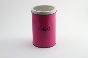 Colorful pink tin storage container on floral pattern