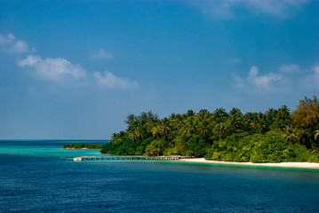 The islands and atolls of the Maldives in the tropical waters of the Indian Ocean