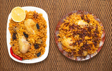 Traditional Indian chicken Biryani with nuts and raisins as close-up.
