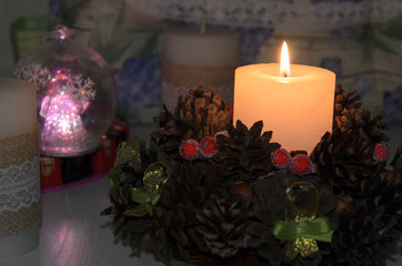 Fragrant candle with Christmas decorations.