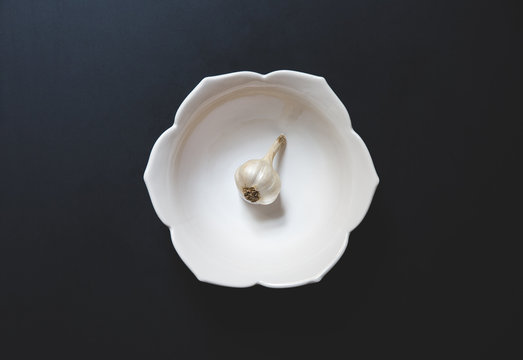 Garlic in a white bowl