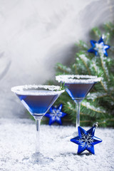 Christmas party composition with two drinks in blue colors snow