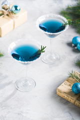Christmas party composition with drinks gift boxes in blue colors