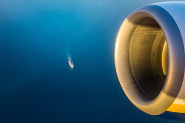 Airplane engine over a ship in the sea
