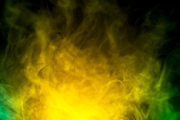 Fototapeta premium abstract yellow and green smoke on black background 