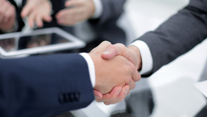 Two confident business man shaking hands