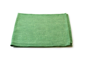 Folded green natural textile napkin on white