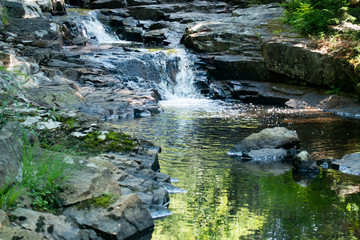 Naklejka na ściany i meble A tiny unnamed waterfall on Robbs Creek in the Adirondacks.